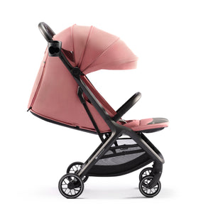 Coche de paseo Kinderkraft NUBI 2 rosa con respaldo reclinado a posición tumbada, apto para recién nacido, vista lateral