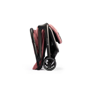 Coche de paseo Kinderkraft NUBI 2 rosa plegado de forma compacta con plegado automático, ideal para viajes y transporte