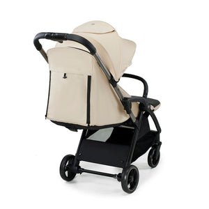 Coche de paseo Kinderkraft APINO beige vista trasera con bolso mochila integrado en el respaldo y detalles en dorado rose gold