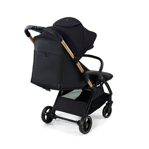 Coche de paseo Kinderkraft APINO negro vista trasera con bolso mochila integrado en el respaldo y detalles en dorado rose gold