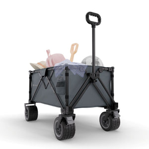 Carrito de transporte plegable Kinderkraft ROLLSTER gris cargado con juguetes y accesorios de playa, ruedas todoterreno y asa telescópica