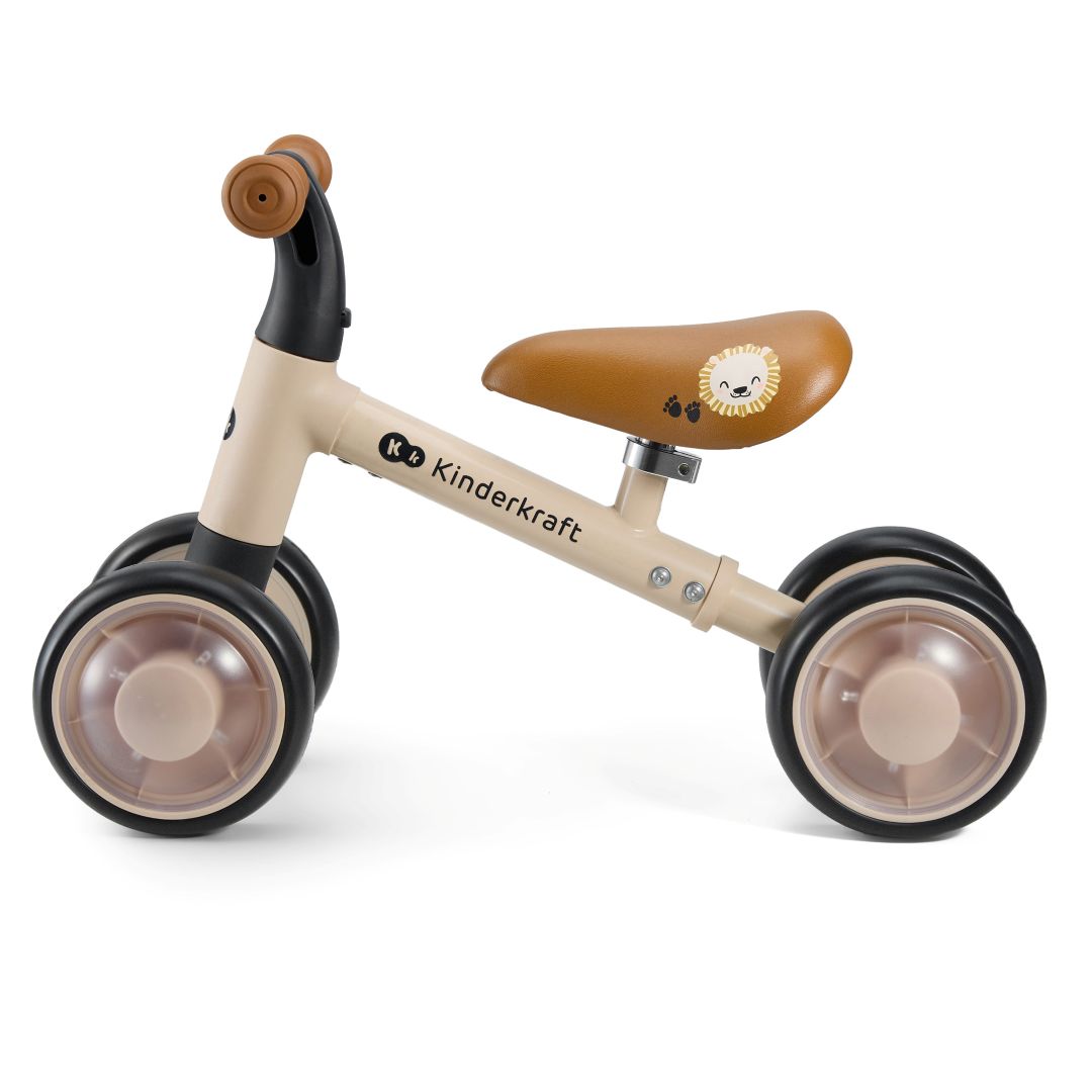 Triciclo correpasillos Kinderkraft CUTIE FLASH beige con ruedas con rodamiento ABEC-7 y luces LED RGB, sillín acolchado ajustable. Andador con estructura de acero estable. Vista lateral.